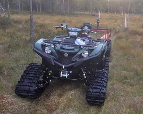 Grön fyrhjuling Yamaha YFM700 Grizzly med bandsats stulen i Ludvika